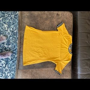 Mustard colored short sleeve shirt, good condition.